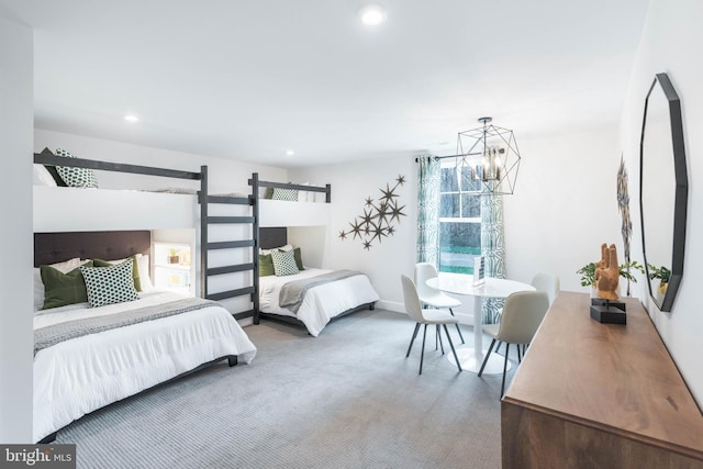 bedroom with carpet flooring and an inviting chandelier