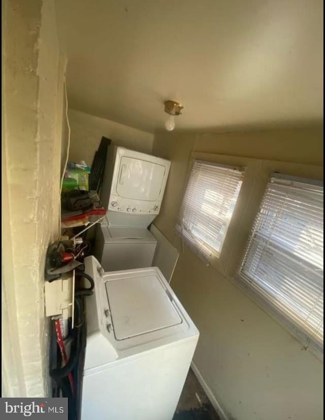 washroom with stacked washer / dryer