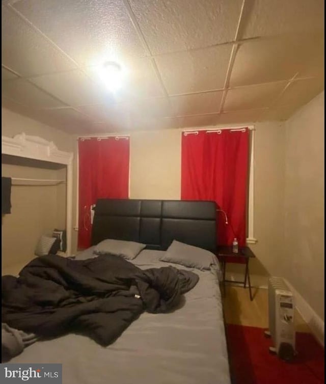 bedroom featuring a paneled ceiling