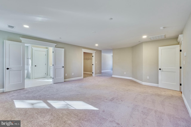 interior space with visible vents, recessed lighting, baseboards, and carpet