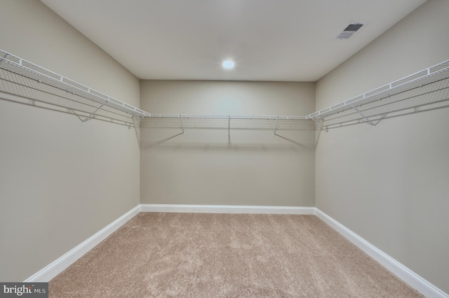 walk in closet with carpet flooring and visible vents