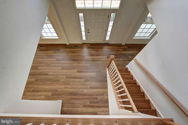 entryway featuring stairway and wood finished floors