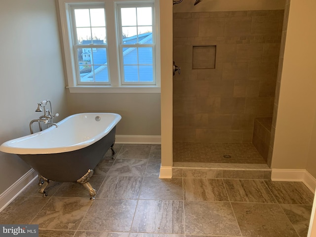 bathroom featuring independent shower and bath and tile flooring