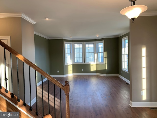 unfurnished room with dark hardwood / wood-style flooring and ornamental molding