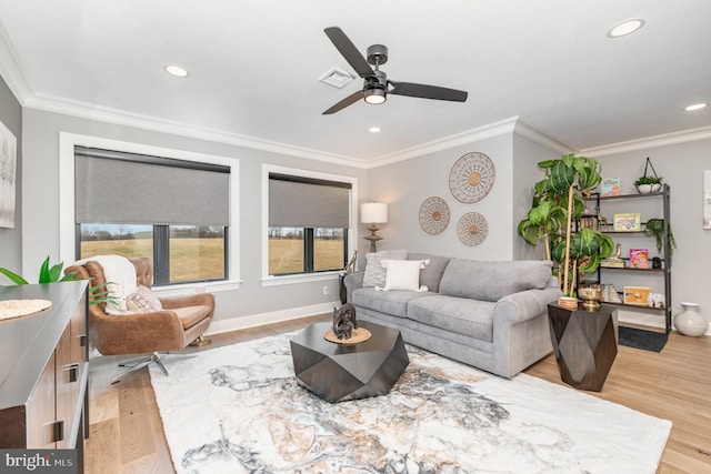 living room with ceiling fan, light hardwood / wood-style floors, and ornamental molding