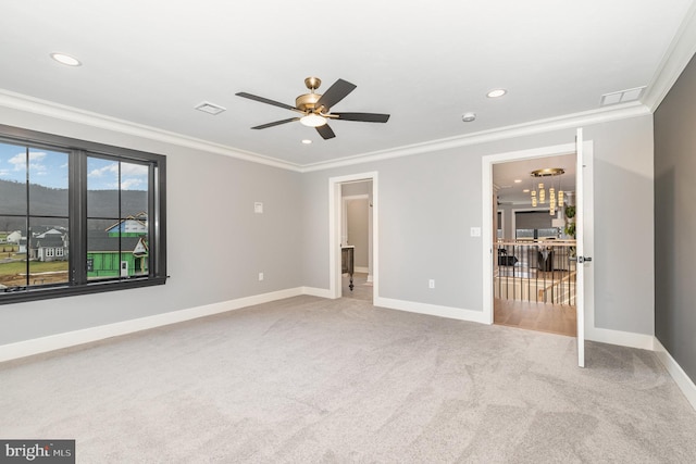 interior space featuring connected bathroom, ceiling fan, carpet floors, and ornamental molding