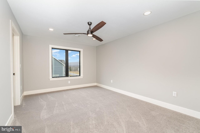 carpeted empty room with ceiling fan