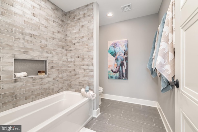 bathroom with toilet and bathtub / shower combination