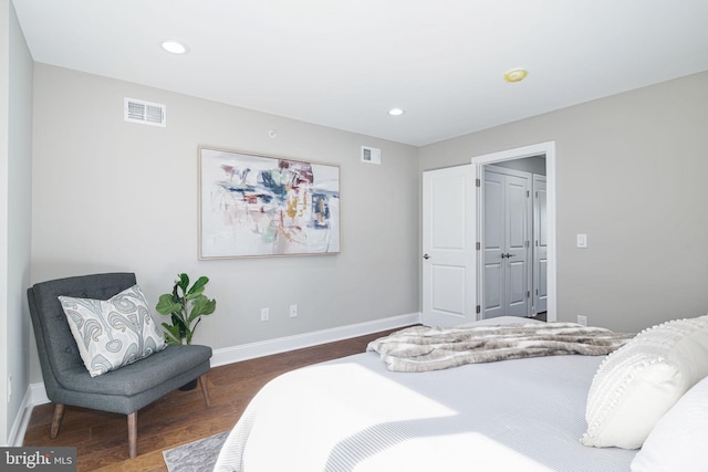 bedroom featuring dark hardwood / wood-style flooring