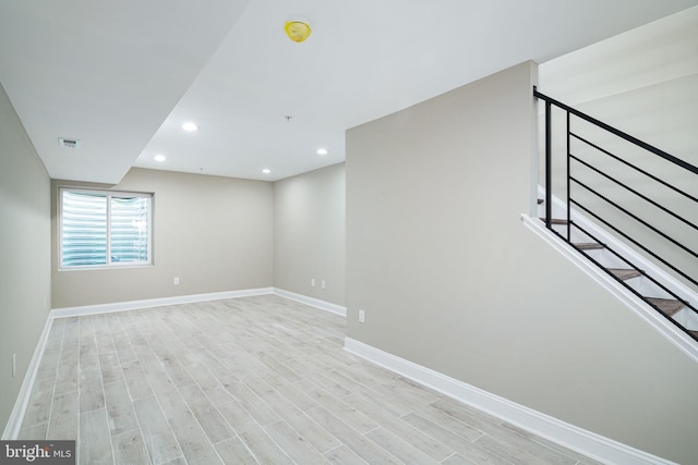 spare room featuring light hardwood / wood-style floors