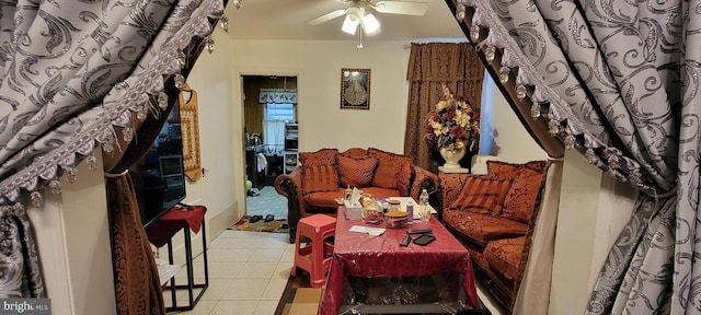 tiled living room featuring ceiling fan