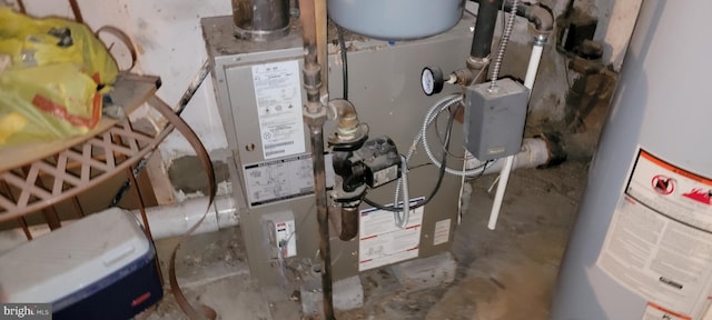 utility room with water heater and heating utilities