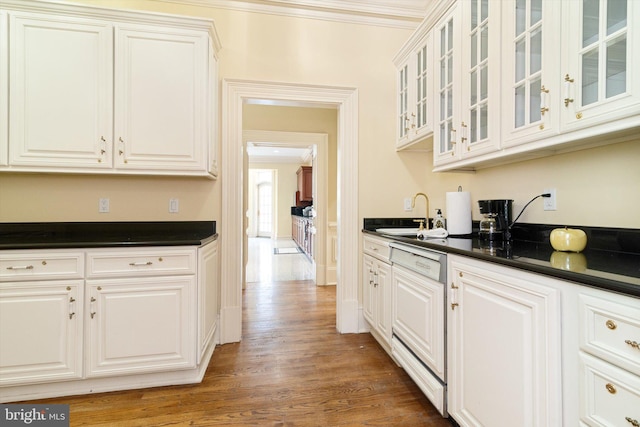 kitchen with white cabinetry, dishwasher, dark wood-type flooring, and sink