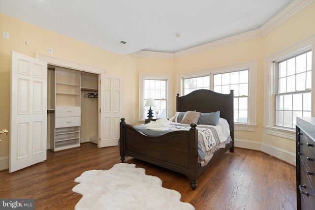 bedroom with dark hardwood / wood-style flooring, multiple windows, and ornamental molding