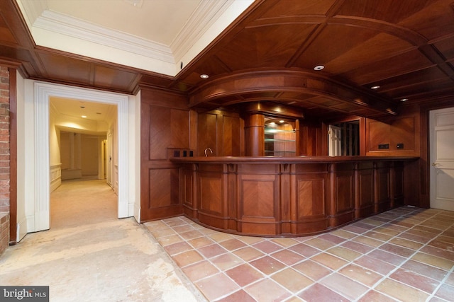 bar with crown molding and wooden walls