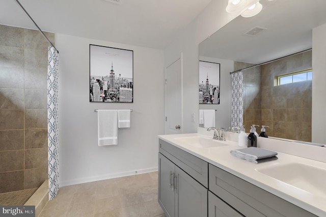 bathroom featuring tile patterned floors, a shower with curtain, and vanity