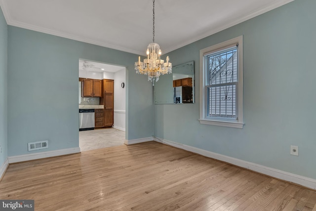 interior space with an inviting chandelier, crown molding, and light hardwood / wood-style floors