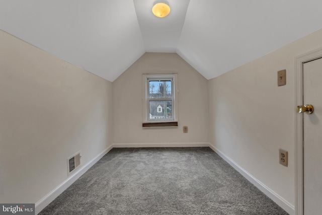 bonus room featuring lofted ceiling and carpet floors