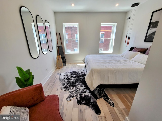 bedroom with light wood-type flooring