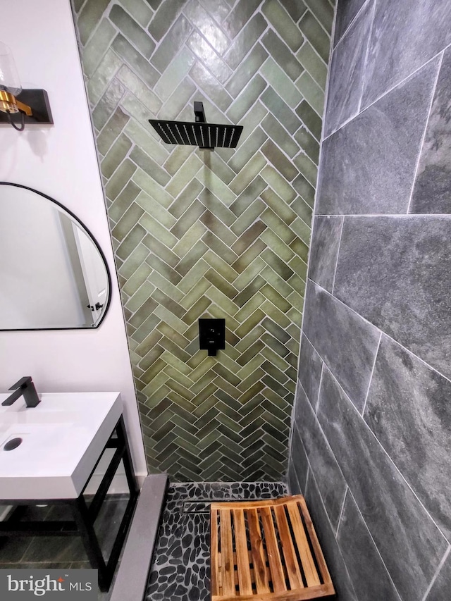 bathroom with a tile shower