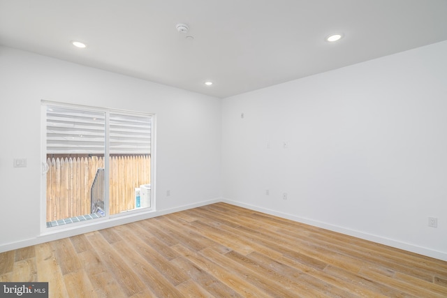 empty room with light hardwood / wood-style floors