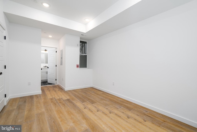 empty room with light hardwood / wood-style flooring