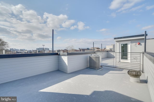 view of terrace with a balcony and central AC unit