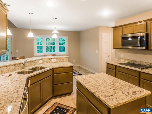 kitchen featuring decorative light fixtures, light tile flooring, sink, and black electric cooktop