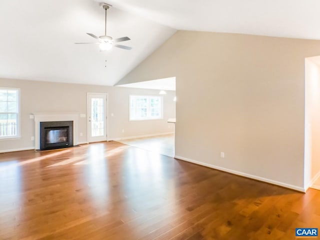 unfurnished living room with high vaulted ceiling, ceiling fan, and light hardwood / wood-style flooring