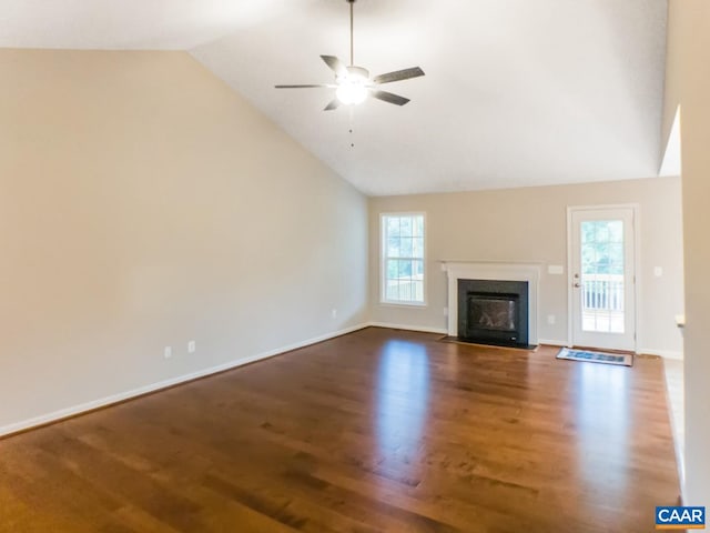 unfurnished living room with dark hardwood / wood-style flooring, ceiling fan, and a healthy amount of sunlight