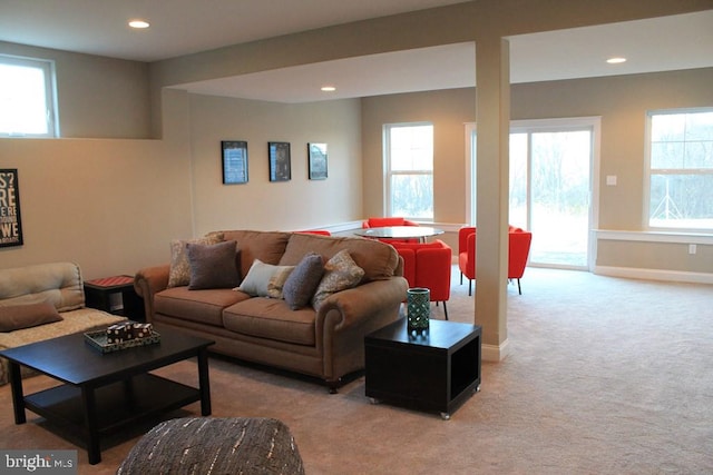 living room featuring plenty of natural light and light carpet