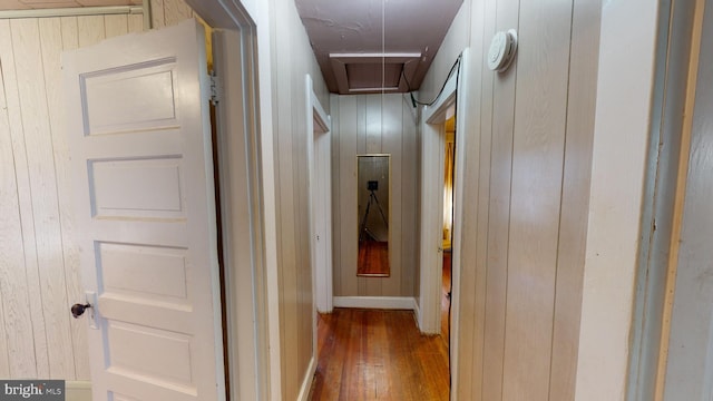 hallway with dark hardwood / wood-style floors