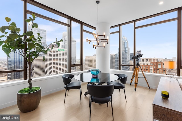 sunroom featuring a notable chandelier