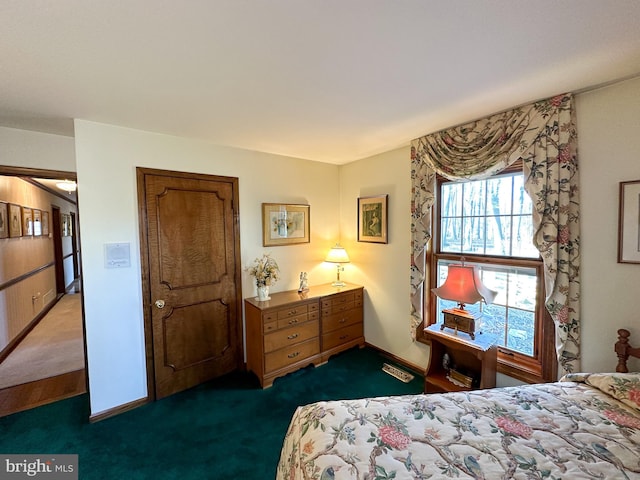 bedroom with dark carpet