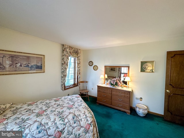 bedroom featuring dark carpet