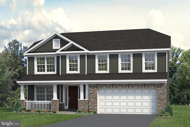 view of front of house with a front lawn, covered porch, and a garage