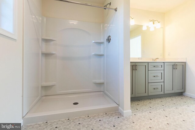 bathroom featuring vanity and walk in shower