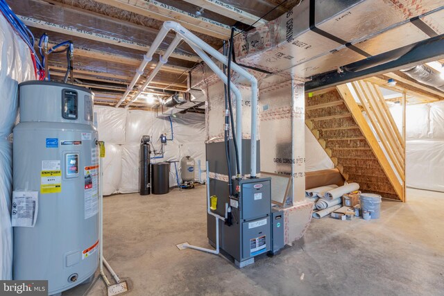 basement featuring water heater and heating unit