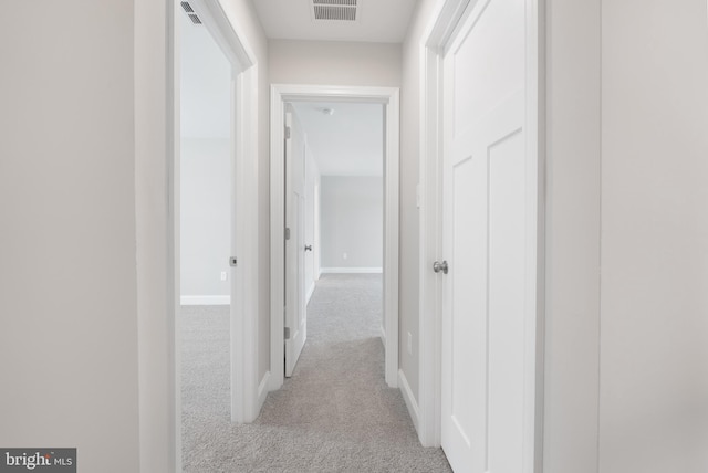 hallway with light carpet