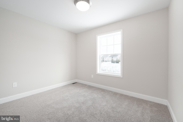 view of carpeted spare room