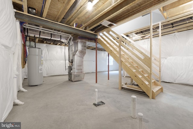 basement with heating unit and strapped water heater