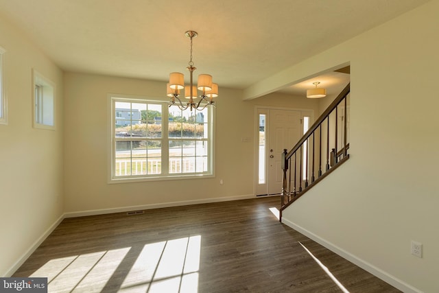 interior space with dark hardwood / wood-style flooring and a chandelier