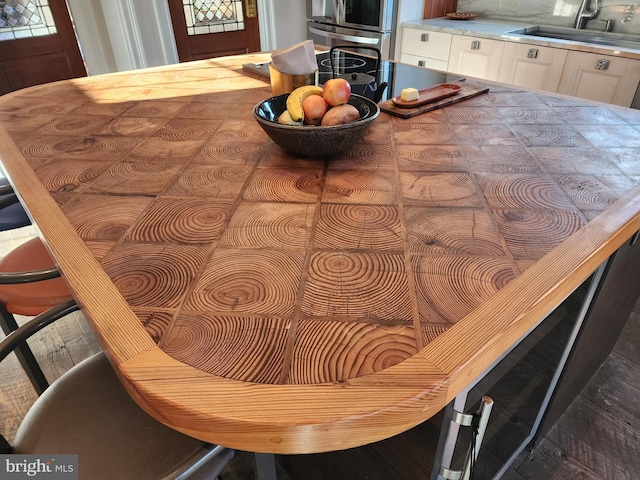 dining room featuring dark hardwood / wood-style flooring and sink