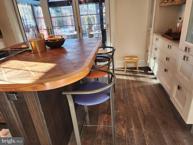 dining area featuring dark hardwood / wood-style flooring