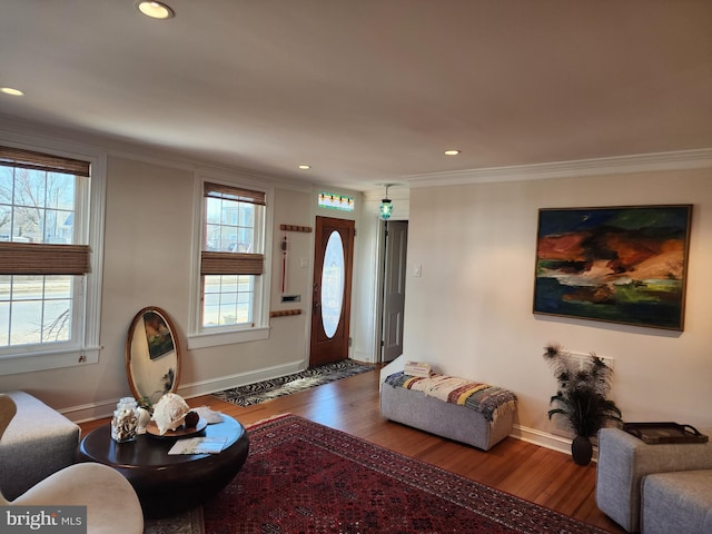 living room featuring dark hardwood / wood-style flooring and ornamental molding