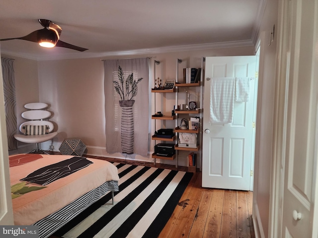 bedroom featuring crown molding, ceiling fan, and light wood-type flooring