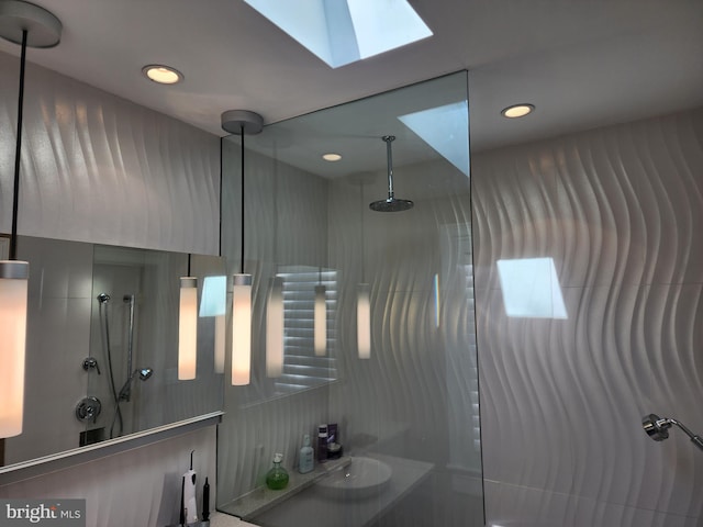 bathroom with walk in shower and a skylight