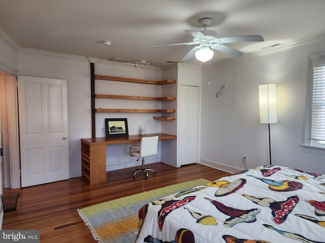 bedroom featuring crown molding, dark hardwood / wood-style floors, and ceiling fan