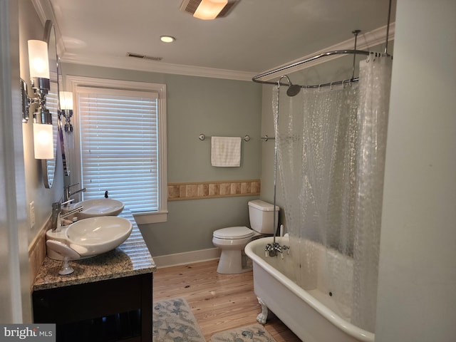 bathroom with crown molding, hardwood / wood-style floors, toilet, and vanity