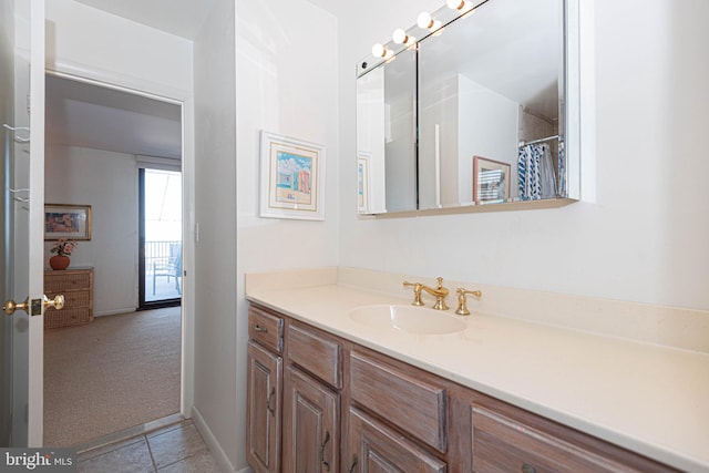 bathroom with vanity and tile flooring